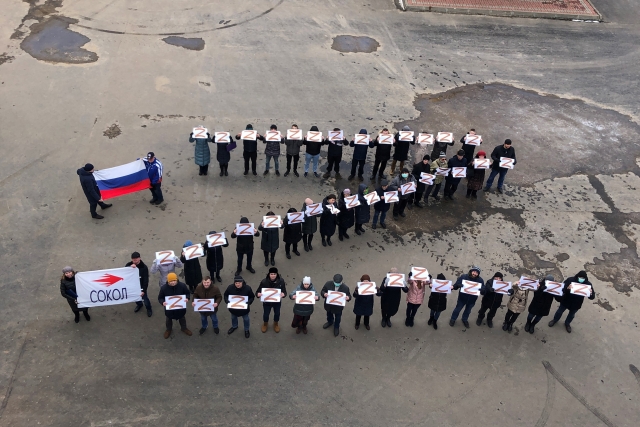 MiG Corp Employees Line up in 